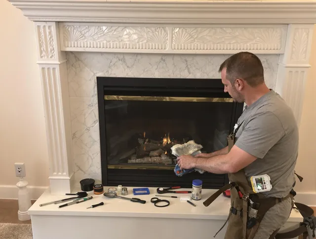 Groton Chimney Sweep performing fireplace maintenance in Groton, CT