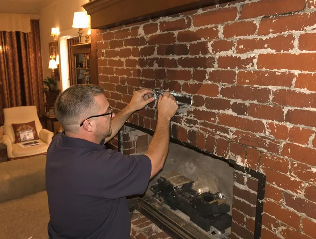 Groton Chimney Sweep expert fixing a fireplace in Groton, CT